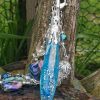 Quartz aura coulé dans une résine époxy pour en faire un pendule collier