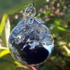Larme d'apache obsidienne sur nuage d'argent, résine epoxy transparente